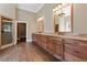Elegant bathroom with double vanity, granite countertops, and large walk-in shower at 309 Marbella Way, Mcdonough, GA 30252