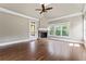 Gathering room with hardwood floors, fireplace, and ceiling fan at 309 Marbella Way, Mcdonough, GA 30252
