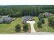 Luxury home nestled in a wooded lot with a large driveway at 309 Marbella Way, Mcdonough, GA 30252
