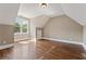 Spacious bonus room with hardwood floors and a large window at 309 Marbella Way, Mcdonough, GA 30252