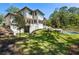 Stunning home exterior with a large backyard and pool at 1068 Moores Mill Nw Rd, Atlanta, GA 30327