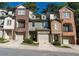 Three townhouses with brick and stone exterior at 2986 Ashlyn Pointe Dr, Atlanta, GA 30340