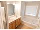 Main bathroom with double vanity, large tub and shower at 2986 Ashlyn Pointe Dr, Atlanta, GA 30340