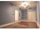 Spacious basement room featuring wood flooring, ceiling fan and built-in shelving at 2986 Ashlyn Pointe Dr, Atlanta, GA 30340