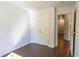 Bright bedroom with double doors to closet and hardwood floors at 2986 Ashlyn Pointe Dr, Atlanta, GA 30340