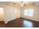Main bedroom with hardwood floors, window and ceiling fan at 2986 Ashlyn Pointe Dr, Atlanta, GA 30340