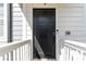 Modern black front door with white trim at 1405 Attwater Dr, Atlanta, GA 30316