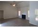 Vaulted ceiling living room with fireplace and hardwood floors at 3475 Washington Rd, Atlanta, GA 30344