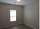 Simple bedroom with window and neutral walls at 3475 Washington Rd, Atlanta, GA 30344