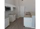 Modern kitchen with granite countertops and white cabinets at 3475 Washington Rd, Atlanta, GA 30344