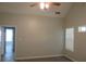 Bedroom with door to additional room and windows at 3475 Washington Rd, Atlanta, GA 30344