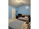 Spacious bedroom with light blue walls and two beds at 2656 Avanti Way, Decatur, GA 30035