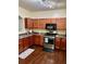 Modern kitchen with wood cabinets and stainless steel appliances at 2656 Avanti Way, Decatur, GA 30035