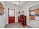 Inviting entryway with charming bench, hardwood floors and view into kitchen at 3112 Highway 155 N, Mcdonough, GA 30252