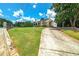 Brick home with a long driveway and landscaping at 3112 Highway 155 N, Mcdonough, GA 30252