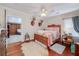 Charming bedroom with hardwood floors and a rustic wooden bed frame at 3112 Highway 155 N, Mcdonough, GA 30252