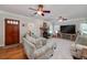 Spacious living room with a stone fireplace and hardwood floors at 3112 Highway 155 N, Mcdonough, GA 30252