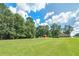 Expansive lawn with outbuildings and main house visible at 3112 Highway 155 N, Mcdonough, GA 30252