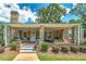 Inviting front porch with stone columns and landscaping at 3112 Highway 155 N, Mcdonough, GA 30252