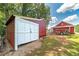 Red storage shed with white double doors at 3112 Highway 155 N, Mcdonough, GA 30252