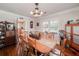 Formal dining room with a large wooden table and hardwood floors at 3112 Highway 155 N, Mcdonough, GA 30252