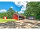 Property with red barn, sheds, and ample parking at 3112 Highway 155 N, Mcdonough, GA 30252