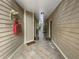 Community hallway with tiled floors and neutral walls at 200 Renaissance Ne Pkwy # 302, Atlanta, GA 30308
