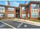 Brick building with stairs and reserved parking at 200 Renaissance Ne Pkwy # 302, Atlanta, GA 30308