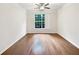 Bright and airy bedroom with hardwood floors and a large window at 200 Renaissance Ne Pkwy # 302, Atlanta, GA 30308