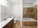 Bathroom with a jetted tub and tiled shower at 200 Renaissance Ne Pkwy # 302, Atlanta, GA 30308