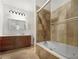 Bathroom with a jetted tub and tiled shower at 200 Renaissance Ne Pkwy # 302, Atlanta, GA 30308
