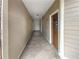 Building hallway with tiled floors and access to unit at 200 Renaissance Ne Pkwy # 302, Atlanta, GA 30308