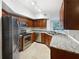 Modern kitchen with granite countertops and stainless steel appliances at 200 Renaissance Ne Pkwy # 302, Atlanta, GA 30308