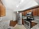 Modern kitchen with stainless steel appliances and granite counters at 200 Renaissance Ne Pkwy # 302, Atlanta, GA 30308