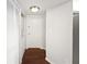 Hallway with wood floors and laundry closet at 200 Renaissance Ne Pkwy # 302, Atlanta, GA 30308