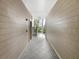 Building hallway with tiled floors and staircase at 200 Renaissance Ne Pkwy # 302, Atlanta, GA 30308
