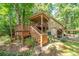 Elevated wooden deck with stairs and gate, near house at 3154 Highway 155 N, Mcdonough, GA 30252