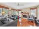 Spacious living room with hardwood floors, fireplace, and ample natural light at 9334 Woodsboro Ct, Jonesboro, GA 30236