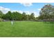 Large backyard with grassy area and swing set at 9334 Woodsboro Ct, Jonesboro, GA 30236