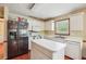 Modern kitchen featuring stainless steel refrigerator and white cabinetry at 9334 Woodsboro Ct, Jonesboro, GA 30236