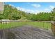 Wooden deck overlooking a fenced backyard at 9334 Woodsboro Ct, Jonesboro, GA 30236