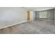 Large bedroom with carpet, window, and neutral walls at 9334 Woodsboro Ct, Jonesboro, GA 30236