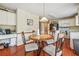 Eat-in kitchen with breakfast nook and access to the living room at 9334 Woodsboro Ct, Jonesboro, GA 30236