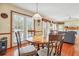 Charming dining area with round table and chairs, adjacent to the kitchen and living room at 9334 Woodsboro Ct, Jonesboro, GA 30236