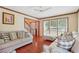 Spacious living room with hardwood floors, neutral furniture, and ample natural light at 9334 Woodsboro Ct, Jonesboro, GA 30236
