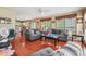 Open living room with hardwood floors, and views into the kitchen and dining area at 9334 Woodsboro Ct, Jonesboro, GA 30236