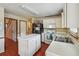 Bright eat-in kitchen with island, stainless steel appliances, and ample cabinet space at 9334 Woodsboro Ct, Jonesboro, GA 30236