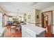 Eat-in kitchen with island, white cabinets, and access to Gathering room at 9334 Woodsboro Ct, Jonesboro, GA 30236
