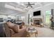 Spacious living room with stone fireplace, high ceilings, and hardwood floors at 1068 W Union Grove Cir, Auburn, GA 30011