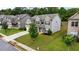 Two-story house with gray siding, brick accents, and a two-car garage at 1068 W Union Grove Cir, Auburn, GA 30011